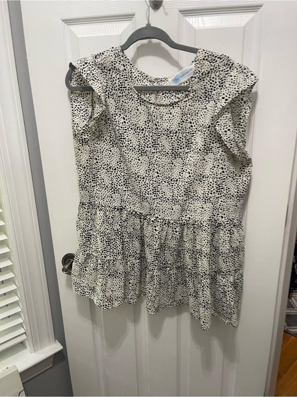 Sleeveless Black & White Dotted Ruffle Peplum Blouse